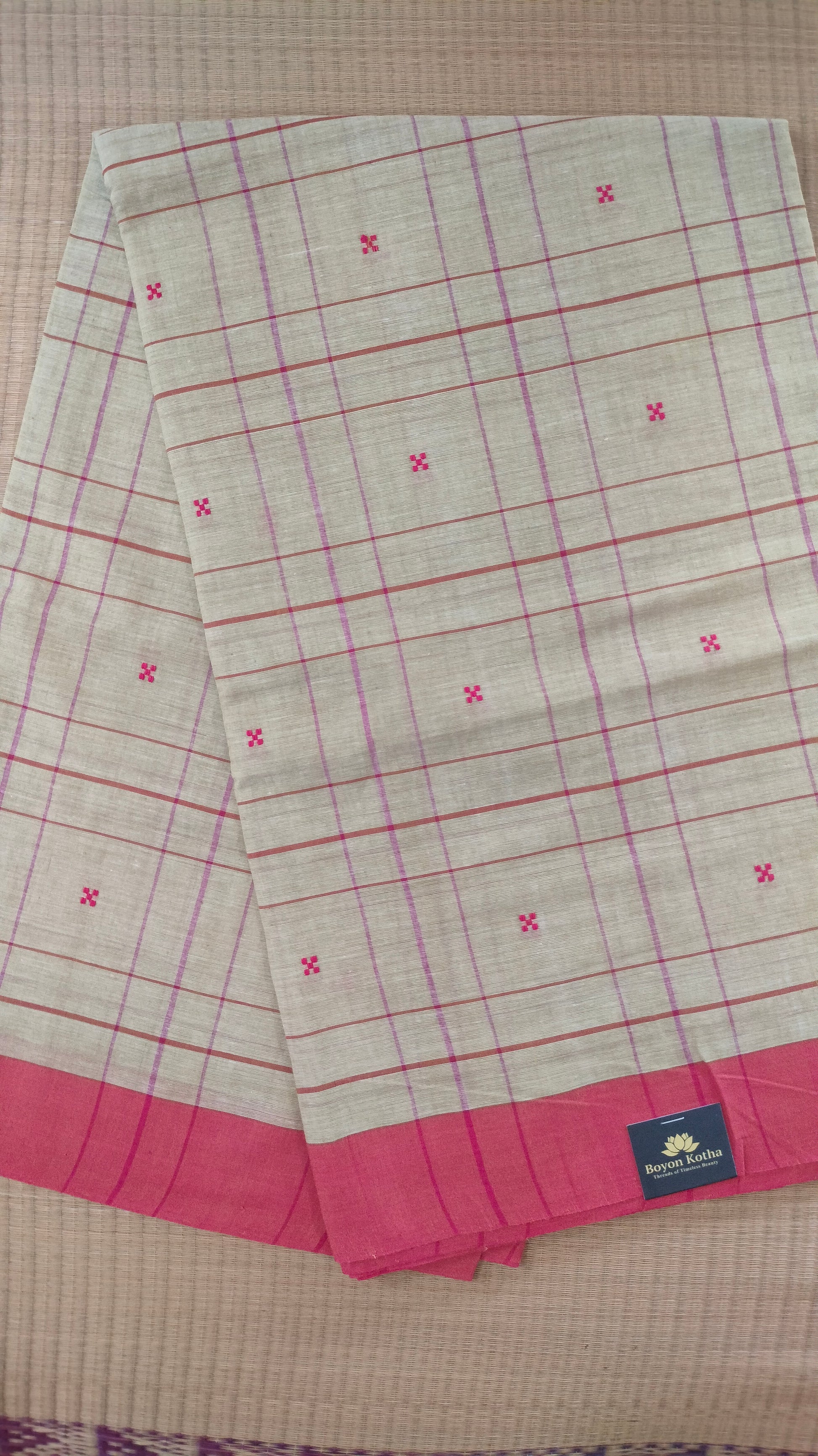 Beige and red Dhonekhali handloom cotton saree with woven red stripes and motifs throughout the saree. Bengal handloom cotton.