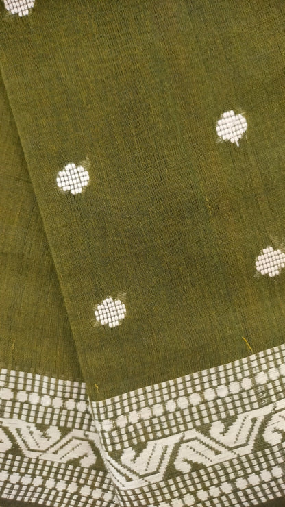 Olive Green Dhonekhali handloom cotton saree with woven white motifs across the body and the border with a black pallu that has woven white vertical stripes.