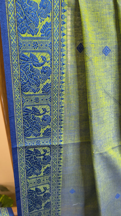 Dual toned green-blue cotton baluchari saree, with woven motifs in the border & pallu in navy blue. Bengal handloom ideal for festivals & everyday celebrations.