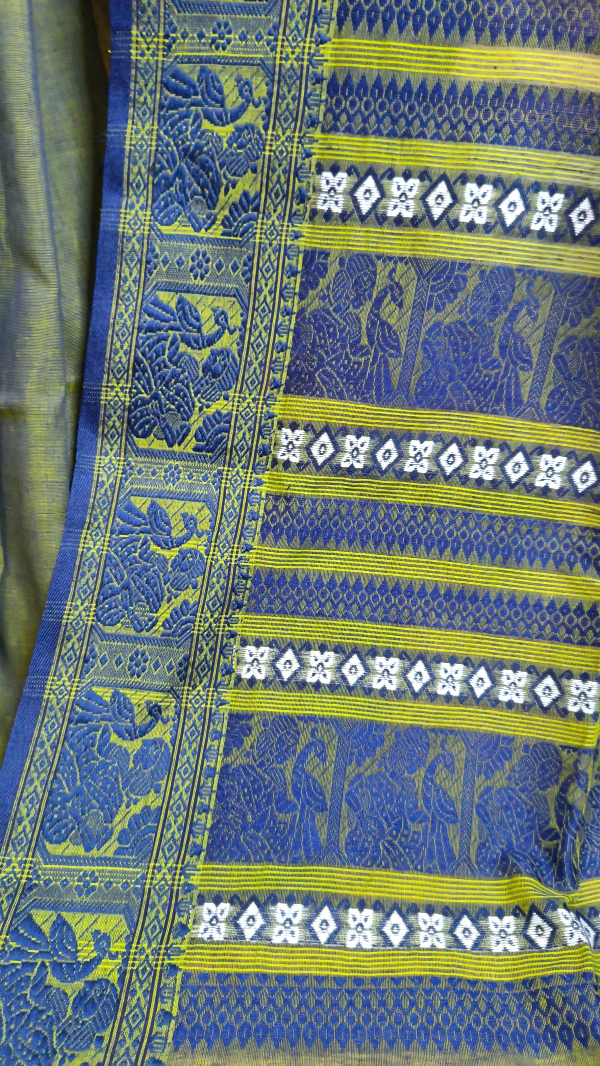 Dual toned green-blue cotton baluchari saree, with woven motifs in the border & pallu in navy blue. Bengal handloom ideal for festivals & everyday celebrations.