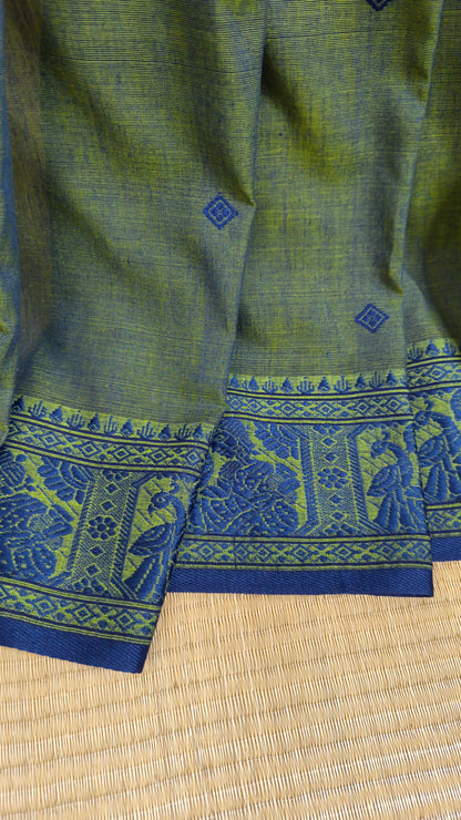 Dual toned green-blue cotton baluchari saree, with woven motifs in the border & pallu in navy blue. Bengal handloom ideal for festivals & everyday celebrations.
