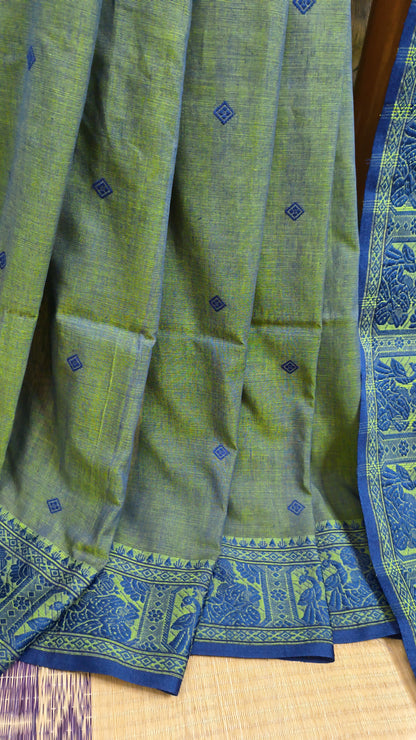 Dual toned green-blue cotton baluchari saree, with woven motifs in the border & pallu in navy blue. Bengal handloom ideal for festivals & everyday celebrations.