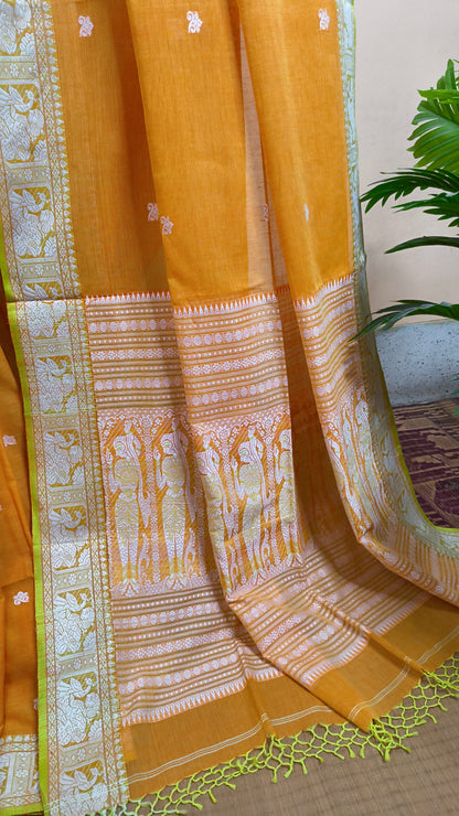 Orange cotton baluchari saree, with woven motifs in the border & pallu in white and neon green. Bengal handloom ideal for festivals & everyday celebrations.