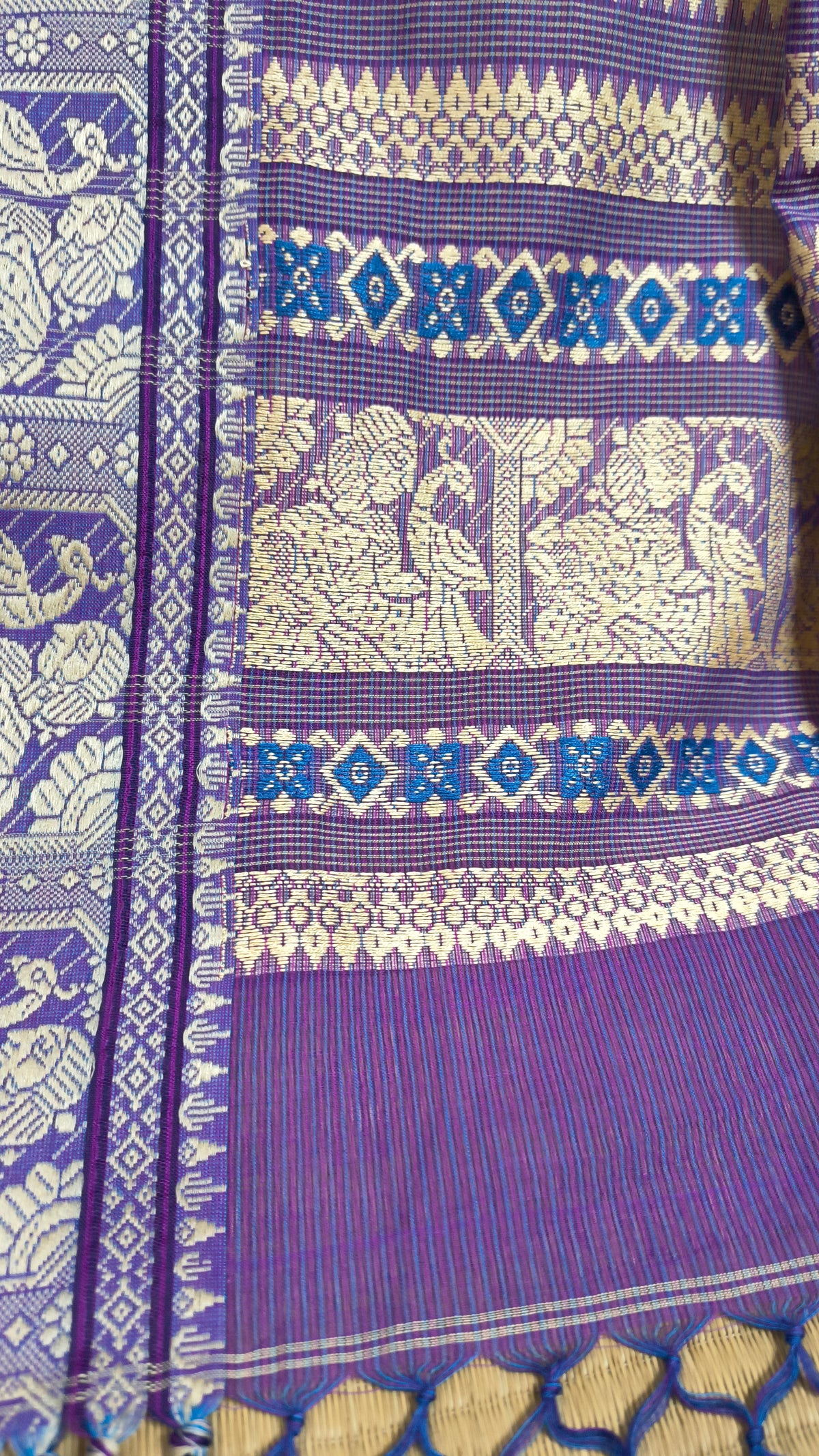 Purple cotton baluchari saree, with woven motifs in the border & pallu in beige. Bengal handloom ideal for festivals & everyday celebrations.