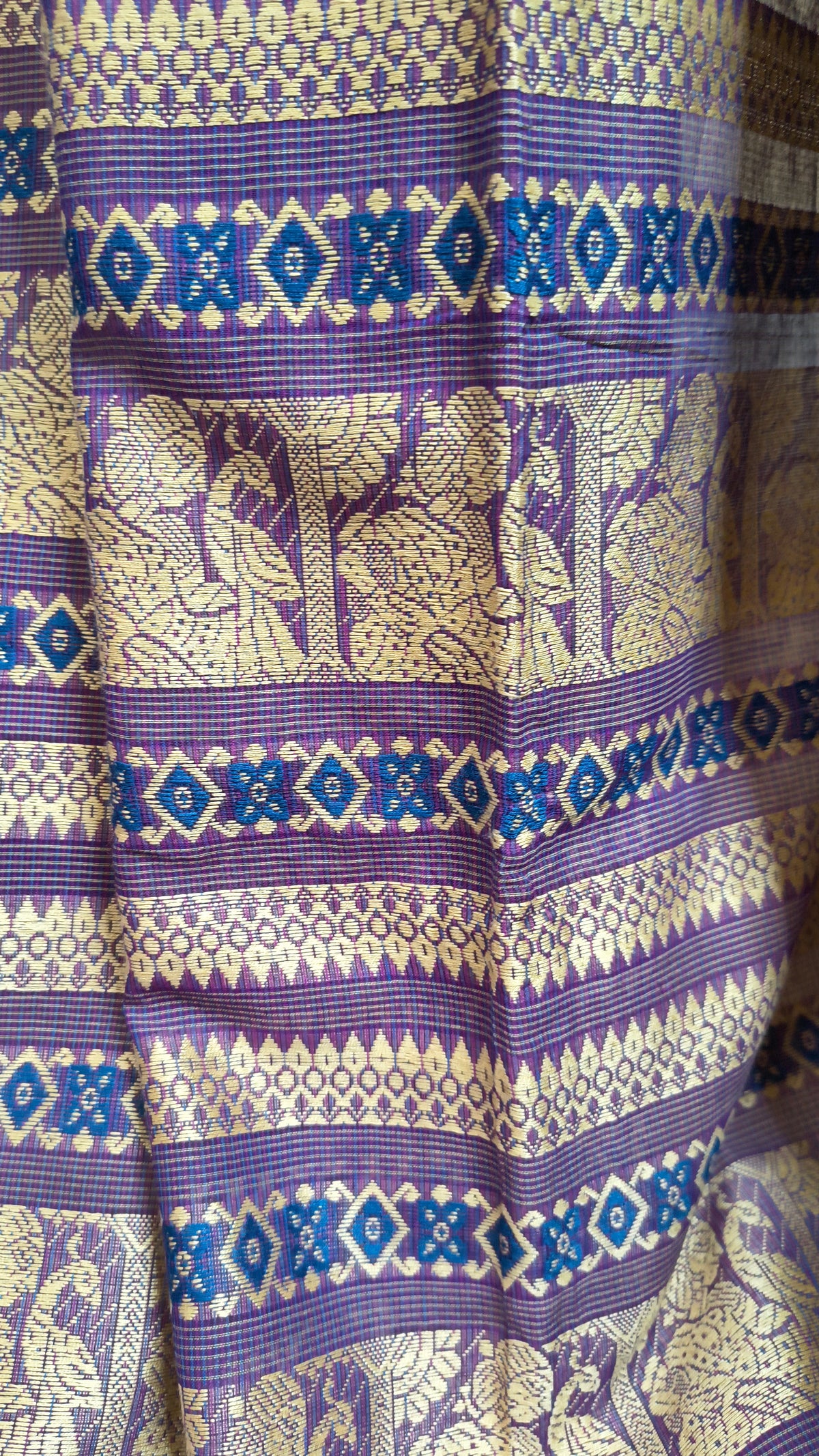 Purple cotton baluchari saree, with woven motifs in the border & pallu in beige. Bengal handloom ideal for festivals & everyday celebrations.
